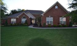 Gorgeous brick home with lots of specialty features including arch entryways, hardwood floors, vaulted ceilings, gas log fireplace, inground pool and bonus room over garage. This beautiful home has over 2600 sq. ft. with 4 bedrooms and 3 full baths. Truly
