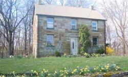 Historic 1870s Built Stone Home With Original Wide Plank Wood Floors, 5 Fireplaces with Original Mantels Intact. Just under 3/4 AC Flat. Large Curved Deck great for entertaining or just enjoying the outdoors. Minutes from Morgantown and just 2 miles off
