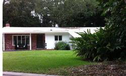 Cozy "cottage" in the heart of Belleair! Updated and open kitchen w/center island and a spacious dining area! Great room features a wood- burning fireplace and built in bookshelves! Plantation shutters create privacy between the main living area and Sun