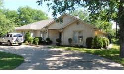 Great home in Pecan Plantation! This spacious 4 bedroom 3 bath home has two master suites or one could be used as seperate guest quarters. Two living areas and a sunroom. A formal dining room as well as a breakfast area. Large circle drive with a 2 car