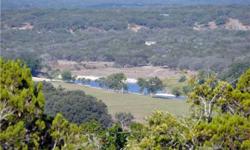 Over 5 acres of breathtaking views of the Guadalupe River, meadow below and distant views of Hill Country from this riverfront property. Large road frontage along one of the highest ridges in the community with several building sites among oaks, cedars