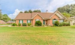 Solid as a Rock! No matter how you look at it this brick 4 BR 3.5 BA home with office makes sense. Split floor plan with foyer entry. Wood flooring. Living room features vaulted ceiling, fp, and french doors to your screened back porch overlooking privacy
