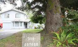 Vintage Home Nestled Amongst the Trees on Ostego! Don't let this home fool you! This is a very large home with plenty of space for everyone! Living Room has a stone hearth wood burning insert for cool evenings. Kitchen with island bar plus eating area
