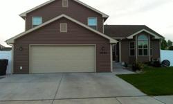 Contact me for more information @ 259-2236 or view more pictures and info on Billings by Owner. Web ID 11687
What a great family home in newer heights subdivision!
The vaulted ceiling in the great room and kitchen/diningroom gives this home an open floor