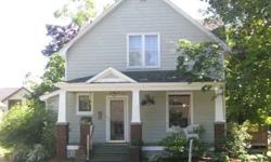Central Neighborhood! Turn-of-the-Century Charmer with Spacious Rooms and Classic Front Porch. 4BR, 1.5 Baths, Oak woodwork, hardwood floors, Sun room, extensive landscaping including mature pond and expansive deck in back yard. 2 car detached garage.