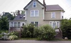 Walk to town from this charming c. 1896 home on a large lot with a clear brook winding through. This Classic New Englander offers unbelievable potential with its fine features of curved interior walls, wainscoting, wide baseboard trim and crown molding.