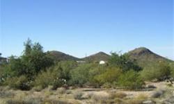 Come see this combined lot of 3.5 acres with septic, shared well, and utilities already on the lot. Gorgeous sunrises and sunsets, views of buttes and mountain vistas. Rolling hills, natural desert, and a million stars and the milky way! Building on