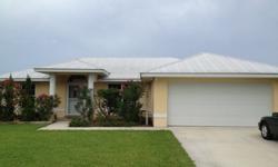 Waterfront with access to Lake Okeechobee. 2 bedroom with office, 2 bath. Built in 2006, CBS construction with energy efficient add- ons. Boat dockage at seawall, beautifully landscaped. High end window treatments, attached garage, concrete driveway,