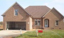 This custom new home features 4 beds, three full bathrooms in a split bedroom plan and is over 2,400 sq.