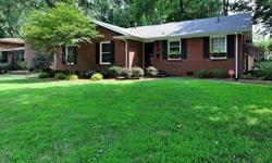 This beautiful all-brick 3 bedroom/2 bath corner lot home has lots of charm and offers gleaming hardwood floors, open floor plan, neutral decor, large formal dining room, gourmet kitchen with granite counters, large center island with breakfast bar, and