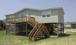 Updated 4 bedroom Beach Box! Located in a culdesac on a low traffic road between highways in Kill Devil Hills. Only 2 lots back from the oceanfront, this home is close to the beach and close to everything else the Outer Banks has to offer. Home is in good