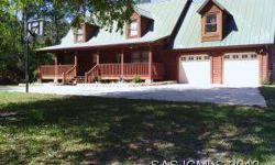 AUTHENTIC LOG HOME! Well maintained 100 ft. on clear water lake front on 1.54 acre lot. Lake view from most rooms open front porch with swing and large lake front open porch on back all appliances,family rm, game rm,& loft that could be used as extra
