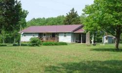 Secluded 40 acre mostly WOODED farm featuring ranch home with steel siding, heavy insulation, OUTDOOR WOOD FURNACE & 30 x 40 METAL OUTBUILDING with lean-to behind. 2 acre STOCKED LAKE with gazebo (with elec.), small dock and deer stand. PERIMETER FENCING.