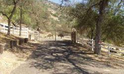 Ornate gate marks the entrance to this 30+ Acre Parcel. Winding paved driveway leads to a great building site with wonderful mountain views. Property includes 1/3 share of a good producing well. Large 10,000 gallon storage tank and fire hydrant in place.