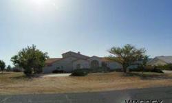 Large home on 1 acre lot located in Hualapai Foothill Estates! Home has an oversized 3 car garage, RV parking, large walk in pantry, 2-sided fireplace, 3 bedroom with a Den, 2.5 bathrooms, private patio with jacuzzi off the master bedroom, washer, dryer &