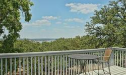 This treehouse style home offers great Lake Travis views and sits on a HUGE double lot complete with wrought iron fencing and fabulous firepit! Such a great house for entertaining and having tons of company to enjoy the lake and hill country! Neighborhood