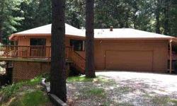 Artistic designed custom home with circular wood ceiling in living room and kitchen areas. This three bedroom, two bath, one level mountain home offers newer synthetic decking. Large picture windows to enjoy the birds and wildlife in forested nature