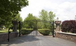 GATED Driveway leads to Two Parcels being sold together w/ one BUILDABLE LOT of 1.22 acre & the other 1.1 ac LOT w/CARRIAGE HOUSE, SPECTACULAR POND w/Waterfalls & PARK-LIKE BEAUTIFULLY LANDSCAPED SETTING! The ALL-BRICK Carriage house was built in 2000
