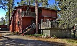 What a beautiful setting! Tall ponderosa pines surround this .67 acre, 2 story; 3 bedroom, 2 bath contemporary with heated AZ room; office area; screened-in porch; 2 car garage w/ large workshop room & wall to wall built-in cabinets. Huge great room