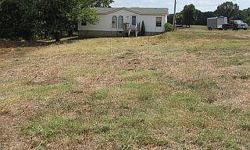 1996 Doublewide in need of repairs. Home offers 3BR, 2BA on 3 acres in Bedford County. Home in need of TLC