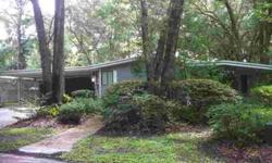 This is a 1988 Palm Harbor, boasting 1700 Sq Ft. It sits on a wonderfully wooded lot, with plenty of shade from Oak trees. Its a 2 Bedroom 2 Bath, with a double carport and a large Utility Room. It also has a Florida Room, Office and a great kitchen,