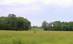 9+/- mostly open acreage with mature trees scattered throughout, gently rolling hills & pond.Listing originally posted at http