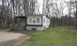 #4000-155 W. LUDINGTON DR. 1972 Champion 12x60 2 bedroom mobile home with updated windows, utility hookup for washer in Kitchen, 3/4 bath, large entrance room, 8'5x10'5 deck, city sewer, water well, gas cook stove, refrigerator, natural gas heat, on a