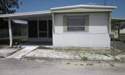 Well established mobile home in Francis I Mobile Home Park. This is a 2 bedroom and 2 bath home with an enclosed side porch with separate laundry room. There is one long covered carport measuring 11x28 with storage area. Home is being sold furnished minus