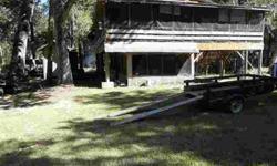 THIS PROPERTY HAS 2 STILT HOMES, 1 BUILT IN 1980 AND THE OTHER IN 1984. (3) BEDROOMS TOTALY, (1) FULLSIZE BATH AND (1) HALF BATH. GREAT FOR HUNTING AND CAMPING. PLENTY OF PRIVACY. ADJACENT TO PRESERVE. APPOINTMENT ONLY.Carol Benton is showing this 3