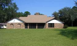 Beautiful 9 acres with pond, large brick home, workshop with electricity and so much more! Huge great room with stone fireplace is great for entertaining. Beautiful loft overlooking great room. View large live oaks from the master bedroom, feed the fish