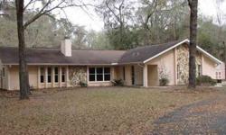 Well maintained concrete block pool home on almost 18 acres on paved road. Home features 3 bedrooms, 2 baths, living room, family room with wood burning fireplace, and spacious sun room opening out to screen enclosed in- ground pool. Large bedrooms and
