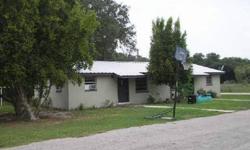2 Duplexes on 4.45 Acres on Tranquil Lake Front Property. ....Have enough room to practice your golf, plus Great fishing. Metal roof in 2007. ....Live in one unit and rent the other 3 units....Being Sold AS IS......... GREAT Potential for many things. One