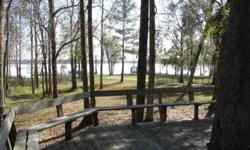 2.8 acres of beautiful waterfront on Lake Talquin in a gated community (17 homes) Custom Built 3 BR and 3 Bath triplewide with 2640 sq.ft. Excellent condition! New heating and cooling system. Equipped with dishwasher, range, refrigerator, washer and