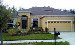 This 4 bedroom, 3 bath, 2 car garage home is located in Seven Oaks, a gated community in Wesley Chapel, Florida. The home offers carpet throughout the house with ceramic tile in the kitchen and bathrooms. The kitchen features wood cabinets with all the