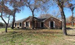 Wonderful all-brick home on just over 1 beautiful treed acre of Texas countryside. The flowing open plan, with cool tile flooring in all living areas, boasts great entertaining spaces with soaring ceilings! You will appreciate the generous eating areas -