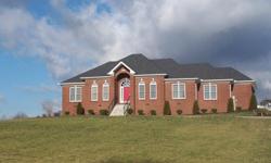 Beautiful Brick custom built home with 3 bedroom and 3 bath, with paved drive, and cement patio with natural gas fire-pit, on 1.67 Acres in Portland , Tn. Home also has natural gas fireplace crown molding, 9' ceilings and master suite. Fenced in back