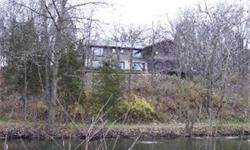 This home is in a private secluded gated community of 9 homes that share an additional 9+ wooded acres with 2 stocked ponds and lots of wildlife. Densely wooded lot on a creek bluff with beautiful views all four sides. Custom built home was originally