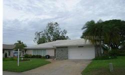 Spacious home with 3 Bed 2 Bath ~ HEATED POOL with Spa features a split plan with over 2,200 square feet of living space, plus an oversized 2 car garage with a spacious workshop area.The plan has a large family room, separate living and dining rooms, a b