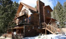 Chalet Living?Filled with Country Charm!
Open and Spacious Main Floor Living Room w/Brick Fireplace! Dining Area + Kitchen Snack Bar, Main Level Bedroom/Office, and Full Bath.
2nd Level?Two Spacious Bedrooms, Full Bath!
Walk-out Level offers Relaxing