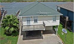 Rare find on the Colorado River with this home! The riverfront home has close proximity to the Gulf of Mexico for great fishing. Strong rental history on the property. Great opportunity for investment for rental and personal use! Nice waterfront home with
