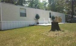 open floor plan. Washer, Dryer, Stove, Refrigerator and Storage Building. Home is a 14 by 70.