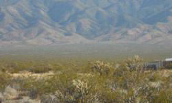 2.5 acres of rural vacant land in Scenic Arizona, overlooking Mesquite Nevada. Fabulous mountain views. Electrical power lines are adjacent to property. Approximately .6 miles from paved county highway and five minutes from Mesquite.Listing originally