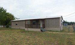 Affordable country living! Two Bedroom, Two Bath manufactured home features spacious living, split bedrooms, large glassed in rear porch plus covered front porch, Wylie Schools, too!! Property is being sold 'as-is' and is subject to HUD Guidelines 14 CFR