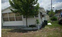 Single Mobile with newer a/c. No monthly dues, fenced yard