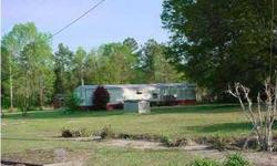 Single Wide Mobile Home - 848sqft 3bedrooms/ 2 full baths. Living/ Dining Room Combo. Small Storage Building, Large Oak Tree for Shade. Nice Parcel with Paved Road Frontage Property " Sold As Is", with some furniture remaining Make this Your Home,