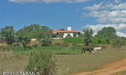 Beautiful custom home situated on a rise overlooking 2 of the many pastures with woodland and mountain backdrops on this glorious 160 acre ranch. The Spanish style home was designed to take advantage of the grand views from every window. High ceilings,
