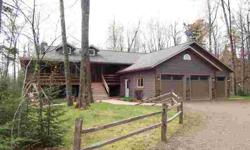 Enjoy Your Privacy in this Beautiful Raised Ranch Nestled on 5 Wooded Acres. Main Floor "Open Concept" (Living Room, Kitchen, and Dining/SunRoom). Amenities Include