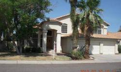 Great home in desirable Val Vista Lakes community. Formal living room, formal dining, eat-in kitchen, sunken family room with a fireplace. First floor has a bedroom and full bath. Large master bedroom with walk-in closet, master bath with separate