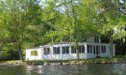 GREAT CONDITION 2 BEDROOM 1 BATH WATER FRONT ON BUKER POND, SANDY BEACH, AMAZING VIEWS, 495 FEET OF WATER FRONTAGE, HUGE STONE FIREPLACE, HOUSE WIDE SUN ROOM WITH WALLS OF WINDOWS, BRIGHT AND SUNNY KITCHEN WITH LOTS OF CABINETS, WATCH THE LOONS FROM YOUR