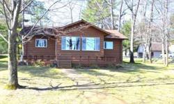 Beautiful rough-sawn, cedar-sided home on East Twin Lake with 101' of frontage, 1468 square feet with 3 bedrooms, 2 baths & an open floor plan. Lovely all-season lakeside sunroom & large lakeside deck. Asphalt driveway as well as a heated 24/x32 garage